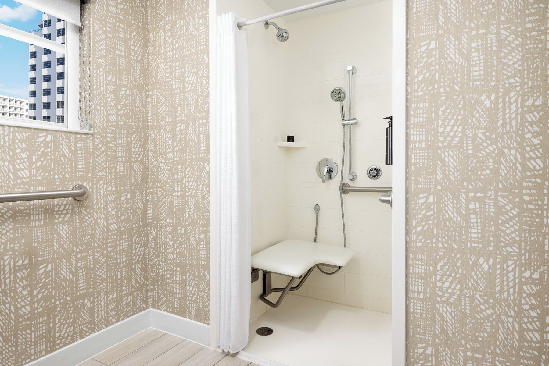 room, 1 king bed (mobility & roll-in shower) | bathroom | designer toiletries, hair dryer, slippers, towels