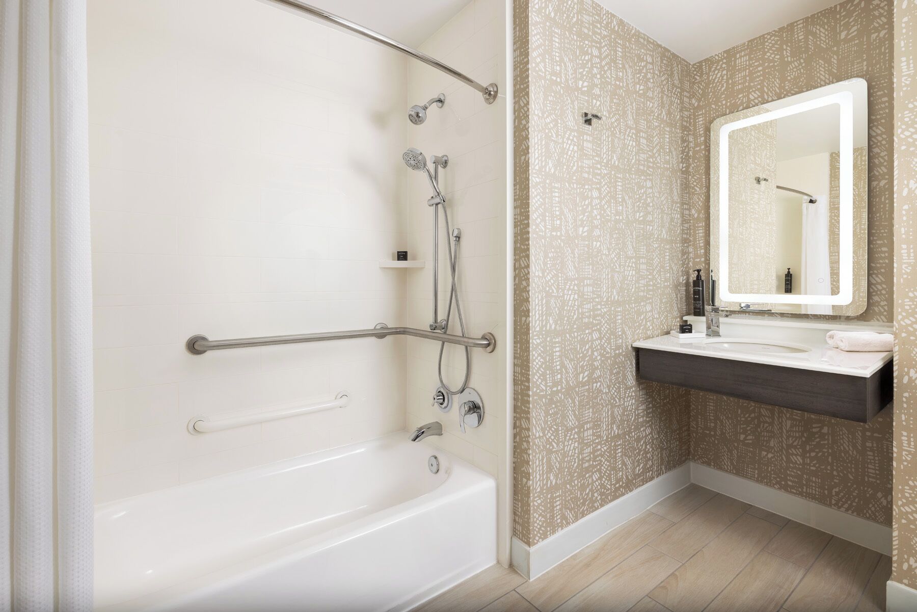 designer toiletries, hair dryer, slippers, towels