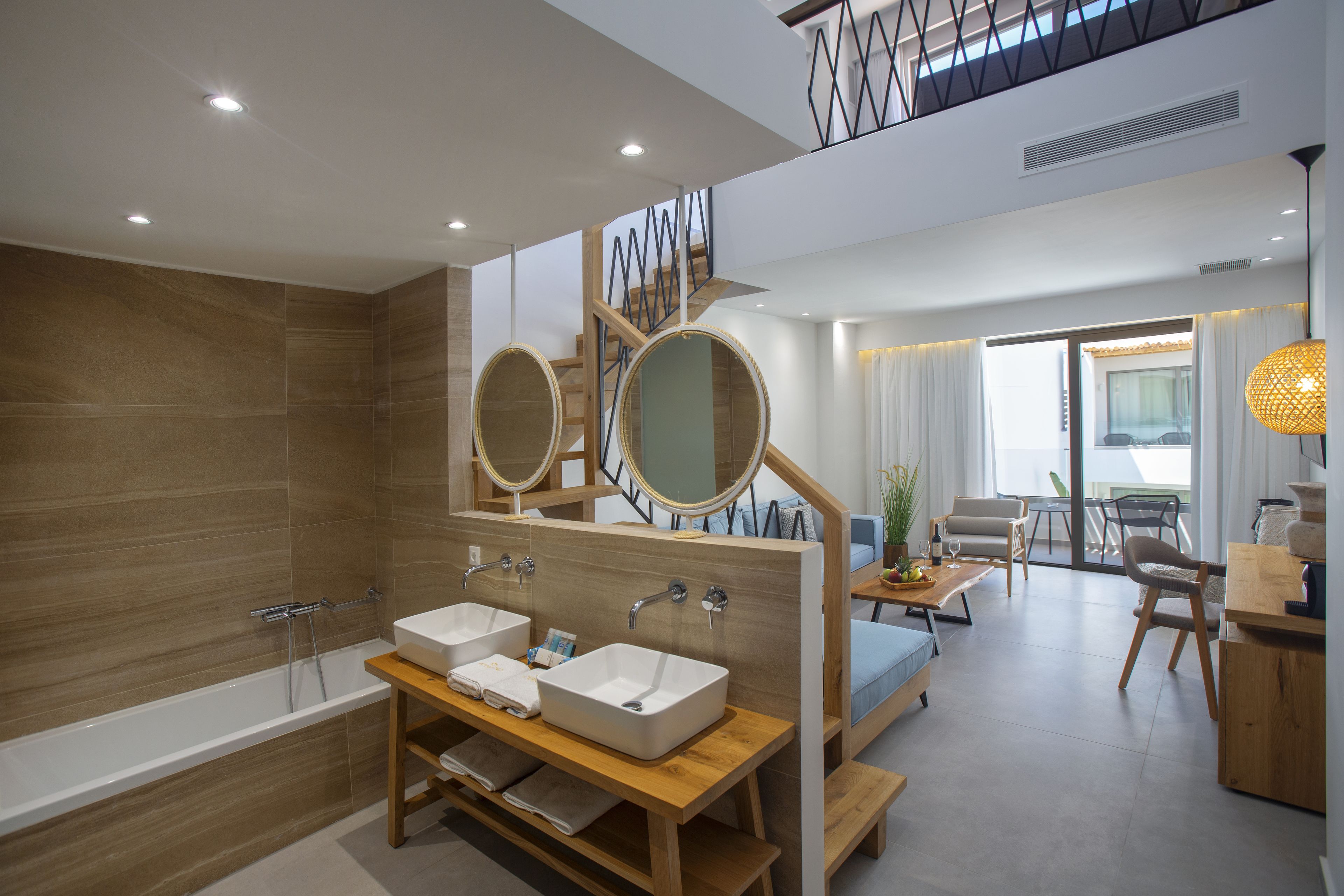 deluxe suite, split level | bathroom | slippers, towels