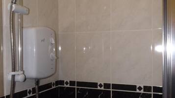 Separate bathtub and shower, free toiletries, hair dryer, towels