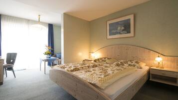 Luxe beddengoed, een kluis op de kamer, een bureau, gratis wifi