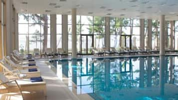 Indoor pool, pool umbrellas, pool loungers