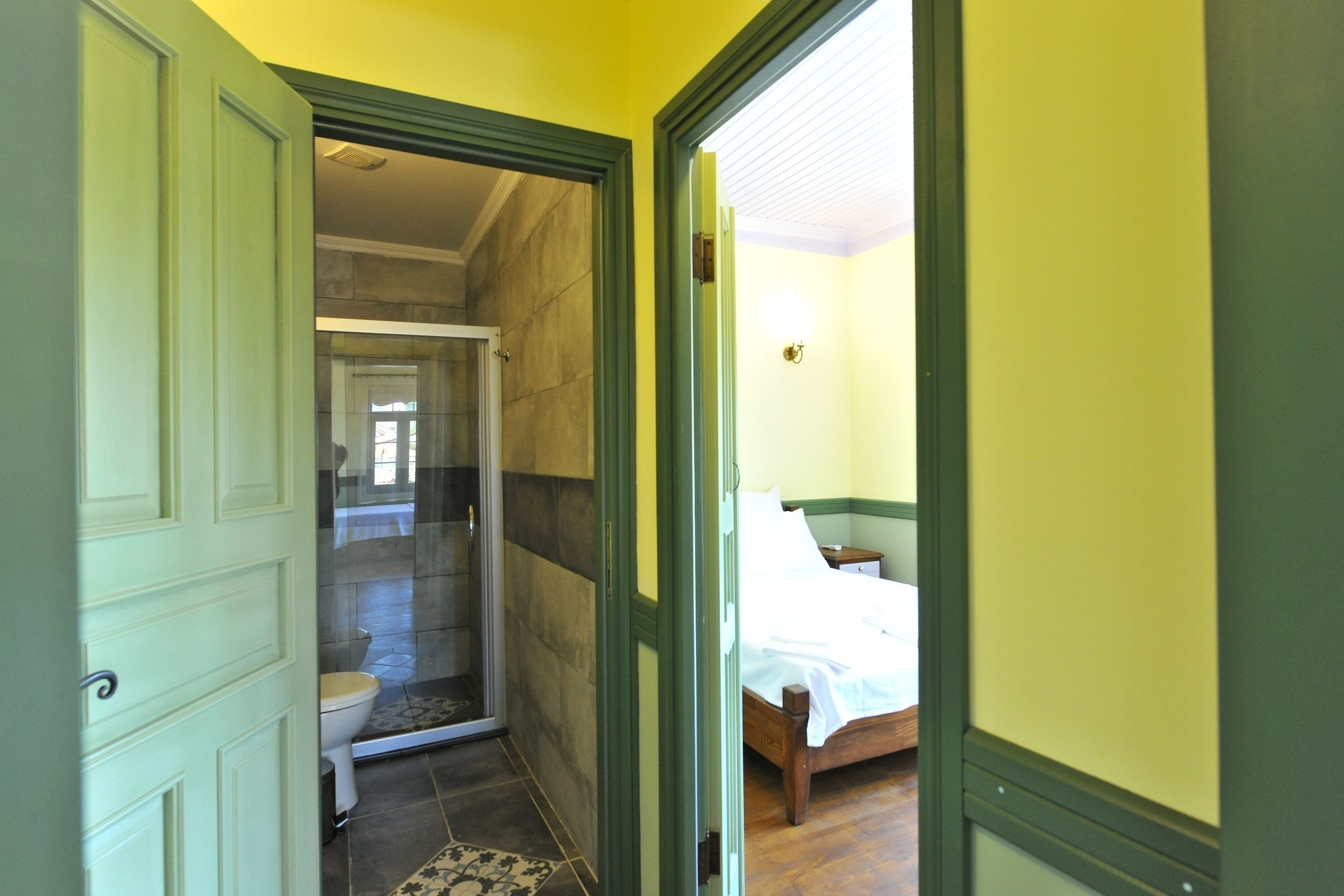 studio, 1 double bed and 1 single bed | bathroom | shower, free toiletries, hair dryer, slippers