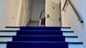 A staircase with blue steps leading to a landing. - Lisbon City Inn Hotel by City Hotels (Lisbon)