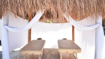 Relax under a thatched roof, surrounded by serene surroundings and tranquil ambiance.