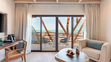 Presidential Ocean Front One Bedroom Suite | Minibar, in-room safe, blackout curtains, iron/ironing board