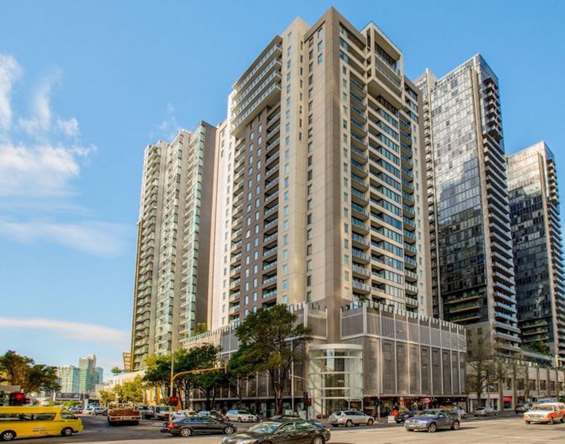 A high-rise building with multiple floors, large windows, and a modern architectural design.
