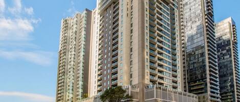 A high-rise building with multiple floors, large windows, and a modern architectural design.