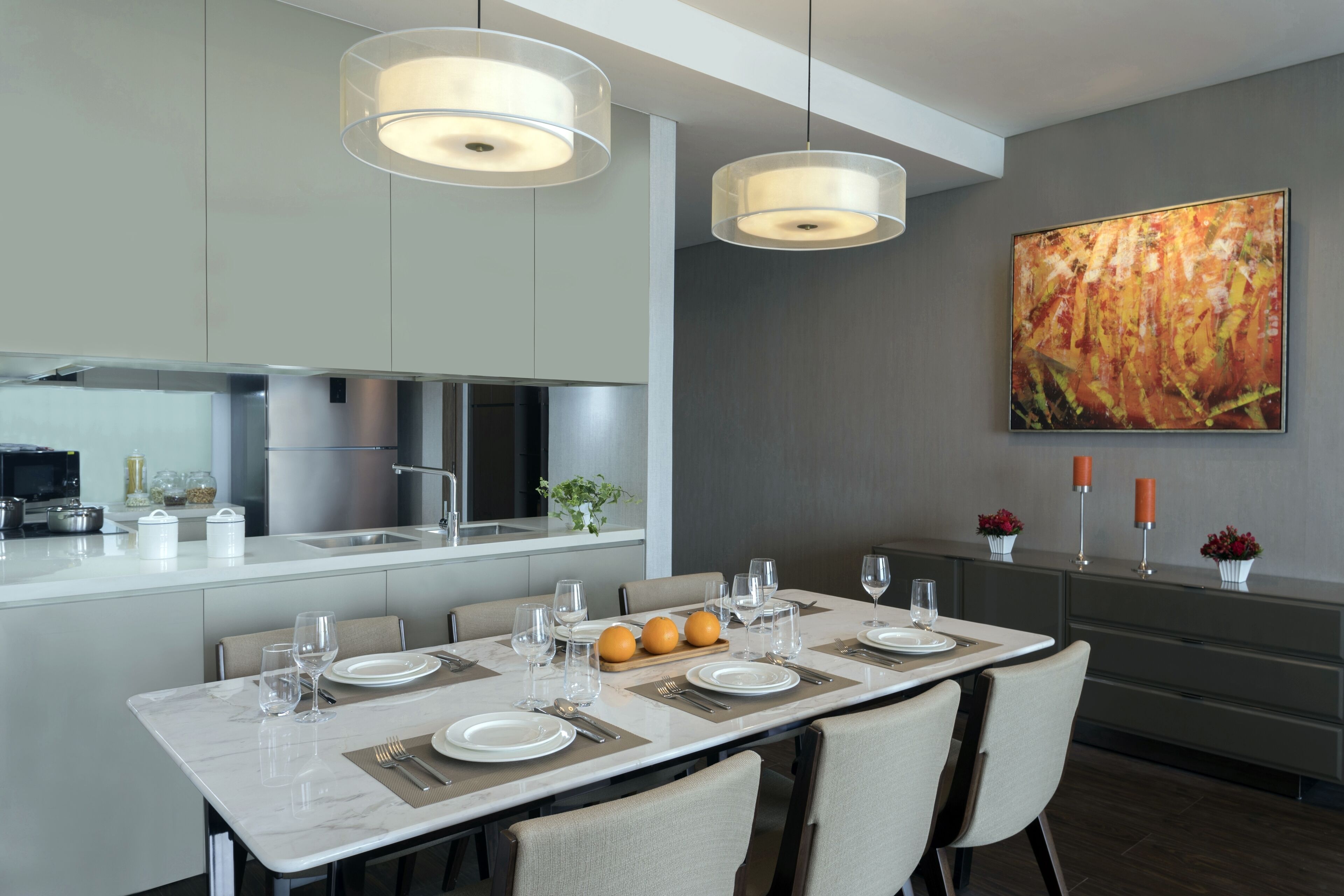 A modern kitchen with a dining area.