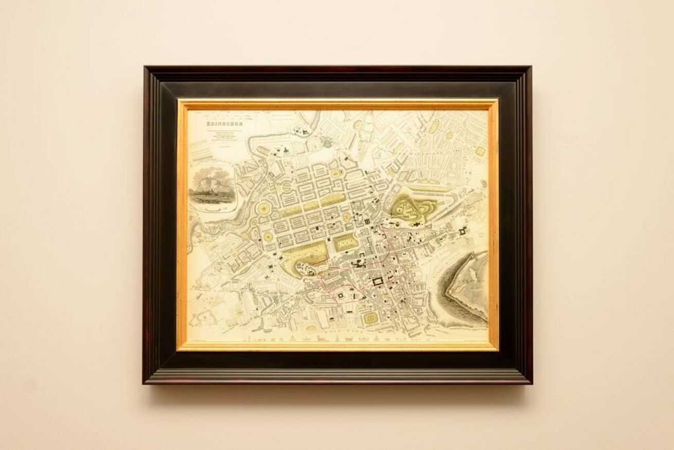 A framed historical map of Edinburgh.