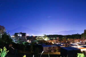 A residential area with houses and a mountain in the background.