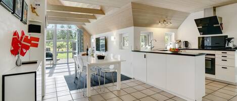 Fridge, stovetop, dishwasher, coffee/tea maker