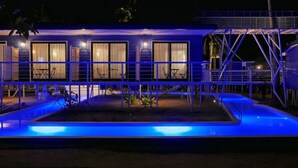 A building with multiple rooms, a pool, and a covered outdoor area. - Apsaras Tribe - Siargao (General Luna)
