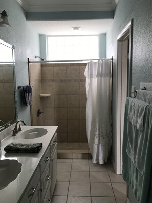 Combined shower/tub, hair dryer, towels, soap