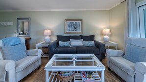 A living room with a sofa, two armchairs, a coffee table, and two lamps. - 2BR w/ Marsh Views! Walk to Tennis/Lake House! Amenities included!Pet Friendly! (Seabrook Island)