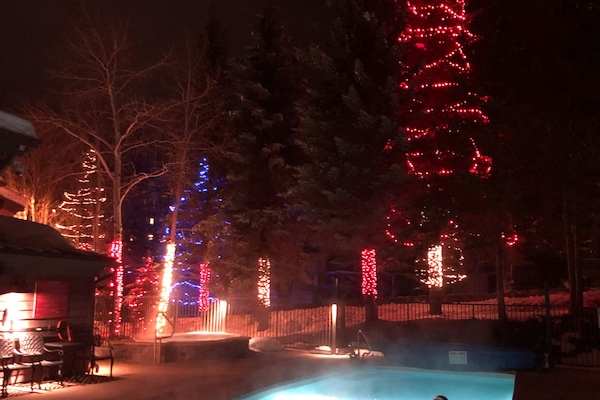 Outdoor heated pool and hot tubs in winter.