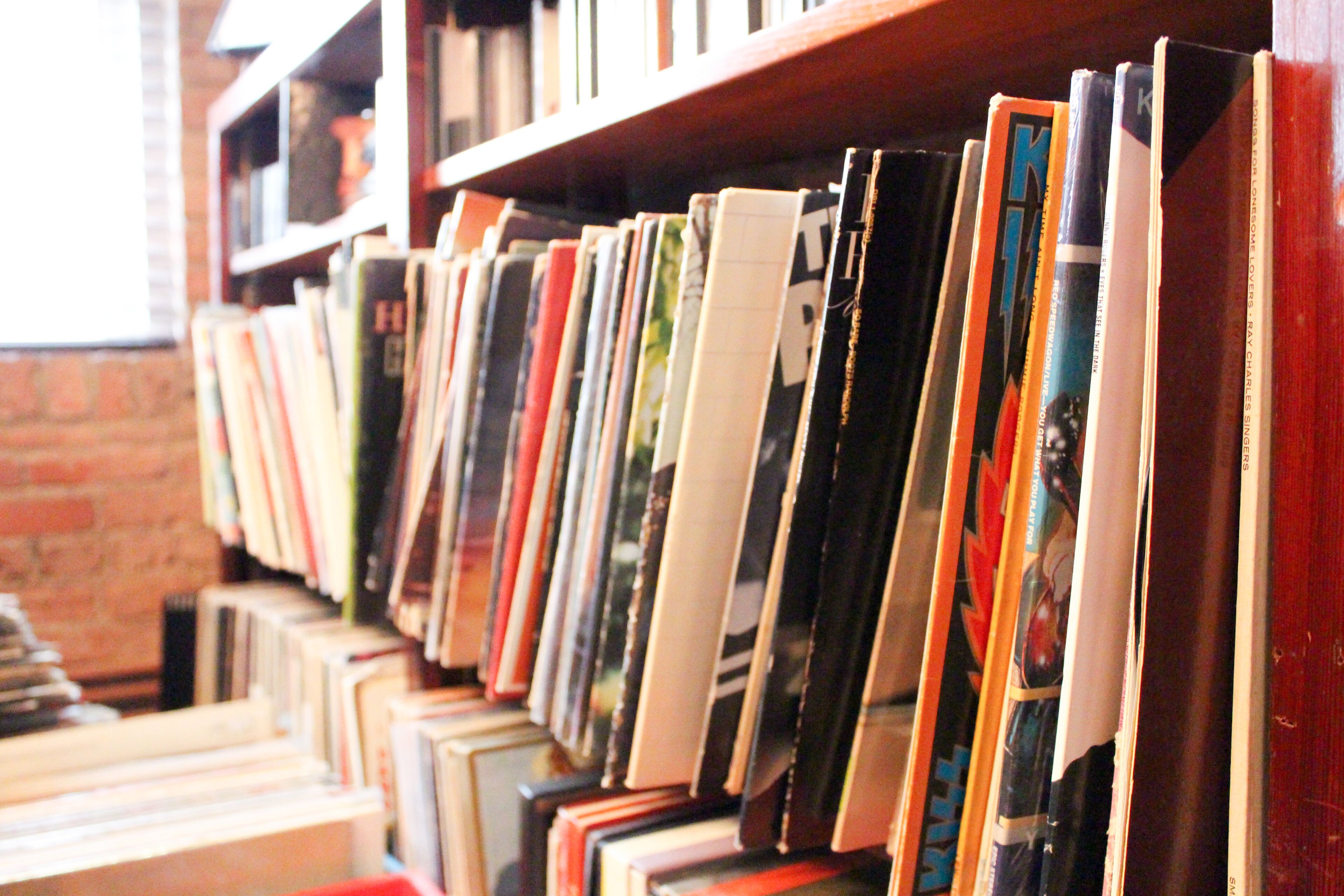 A bookshelf with a variety of books.