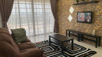 Apartment, 3 Bedrooms | Living area | Flat-screen TV