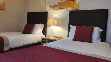 Twin Room | Desk, blackout drapes, iron/ironing board, free WiFi