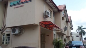 A hotel with a sign reading "Avery Hotel" and an air conditioning unit. - Avery Hotel (Abuja)