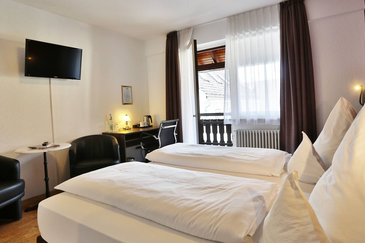 double or twin room | desk, blackout curtains, cots/infant beds, rollaway beds