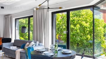 Premier Apartment, 1 Bedroom, Kitchen, City View | Living area | Flat-screen TV