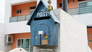 A blue mailbox with a roof, a small antenna, and a ladybug decoration. - Mi Casa Bed and Breakfast (Taitung)