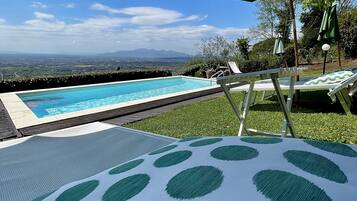 Seasonal outdoor pool, open 8:30 AM to 7:30 PM, pool umbrellas