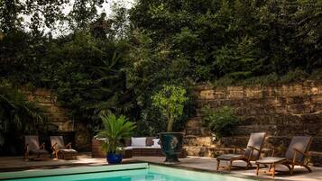 Seasonal outdoor pool, open 10:30 AM to 8:30 PM, pool umbrellas