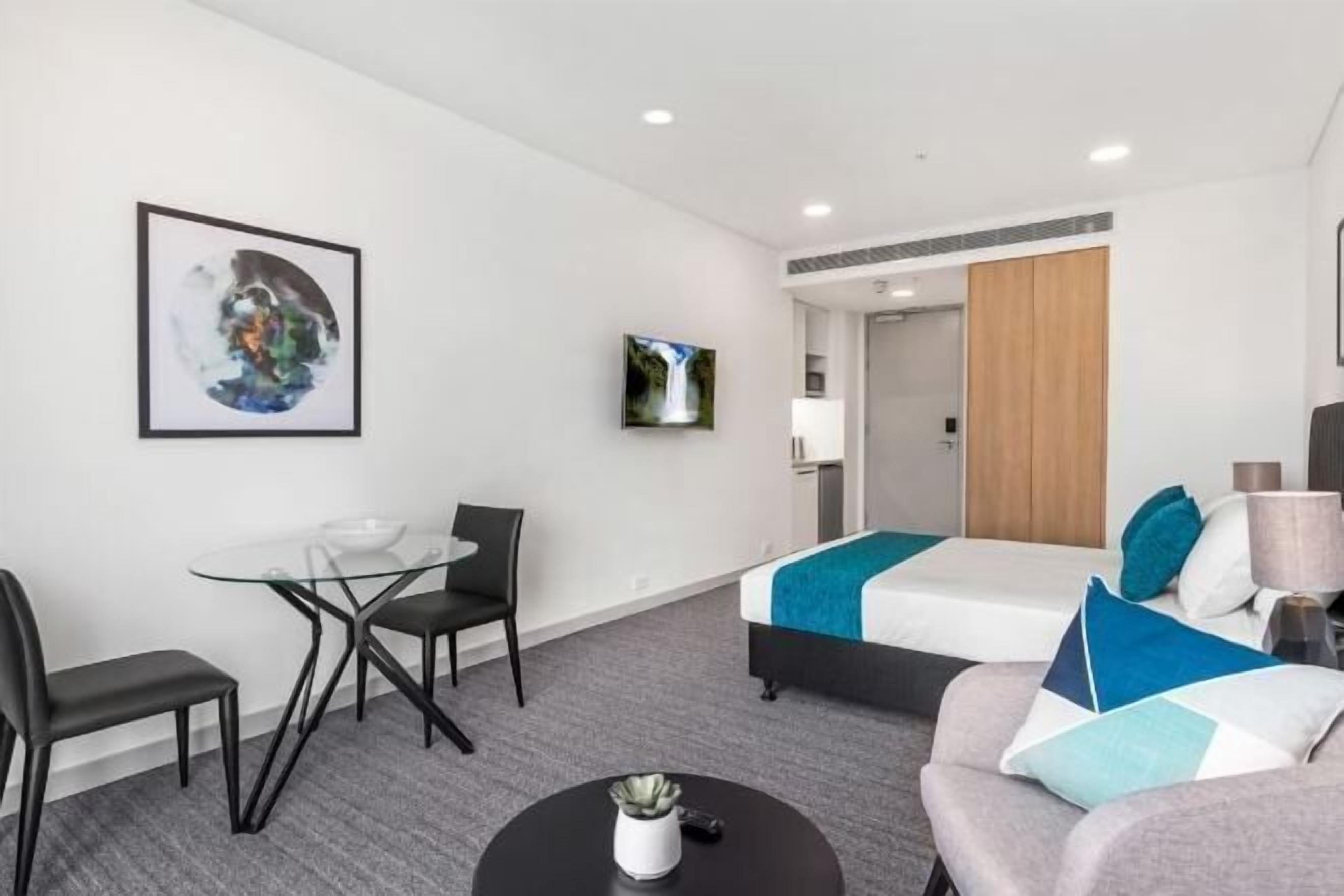 Premium bedding, laptop workspace, blackout curtains, soundproofing