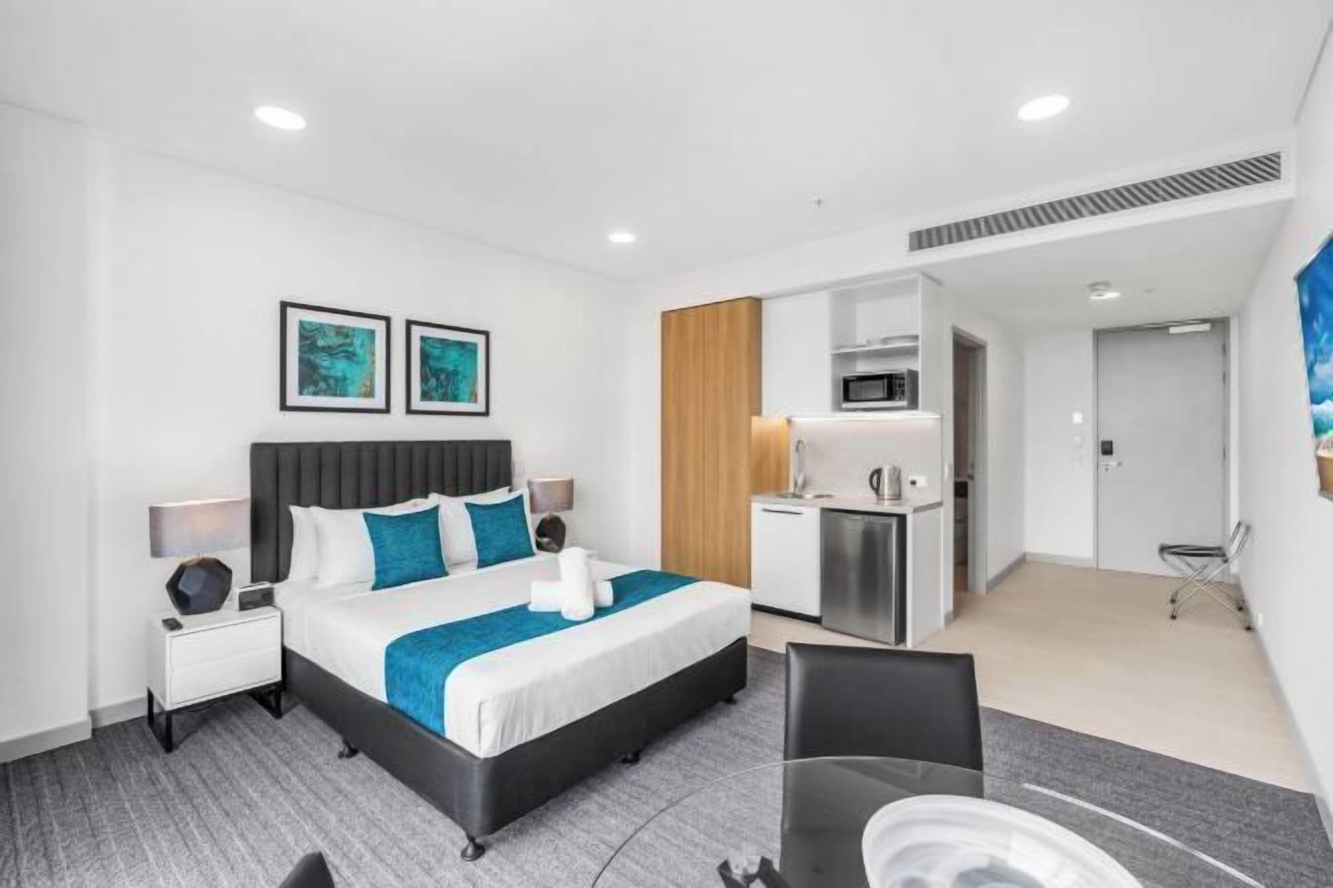Premium bedding, laptop workspace, blackout curtains, soundproofing