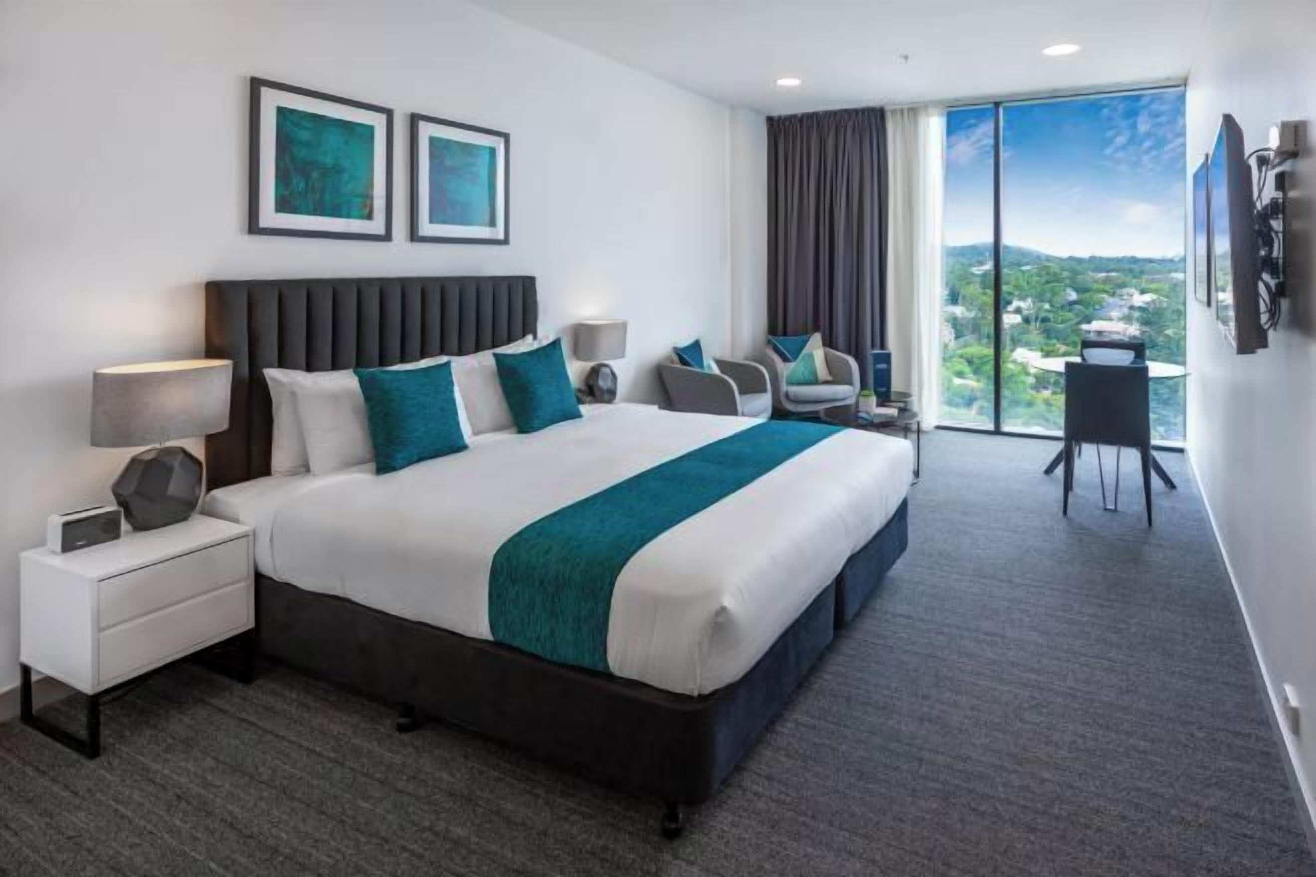 Premium bedding, laptop workspace, blackout curtains, soundproofing