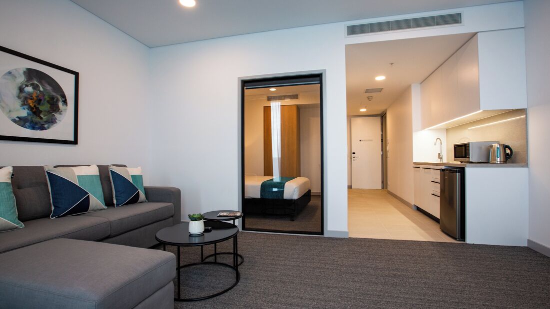 2 bedroom dual king | living area | 48-inch flat-screen tv with cable channels