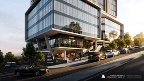 A modern building with a glass facade, multiple floors, and a ground-level entrance. - Essence Suites Taringa (Taringa)