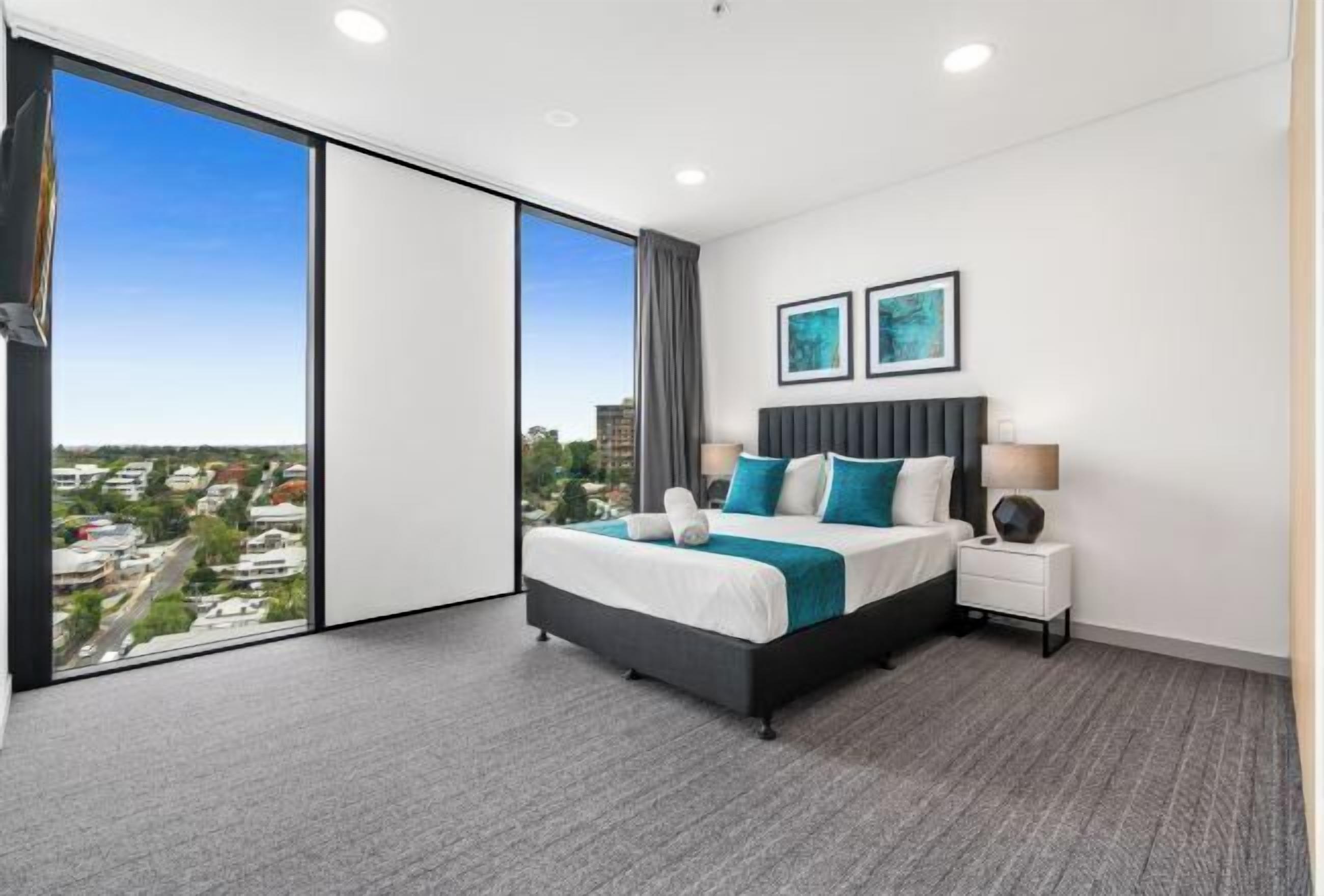 Premium bedding, laptop workspace, blackout curtains, soundproofing