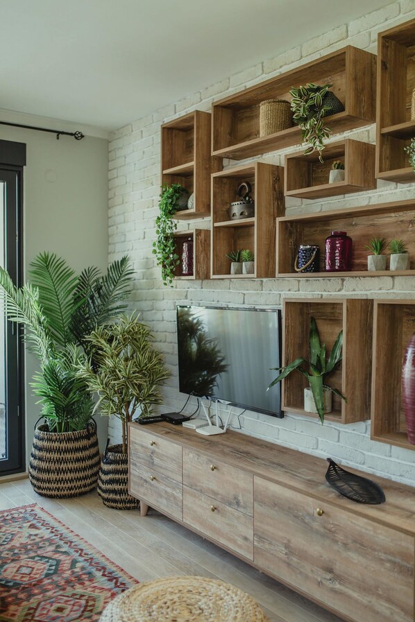 Deluxe-Apartment | Wohnzimmer | Flachbildfernseher