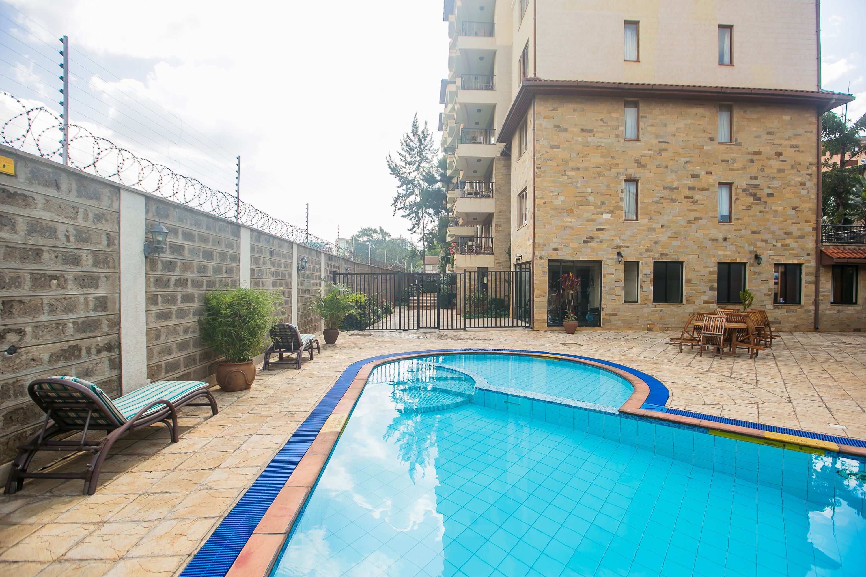 outdoor pool, open 6 am to 6:30 pm, pool umbrellas, pool loungers