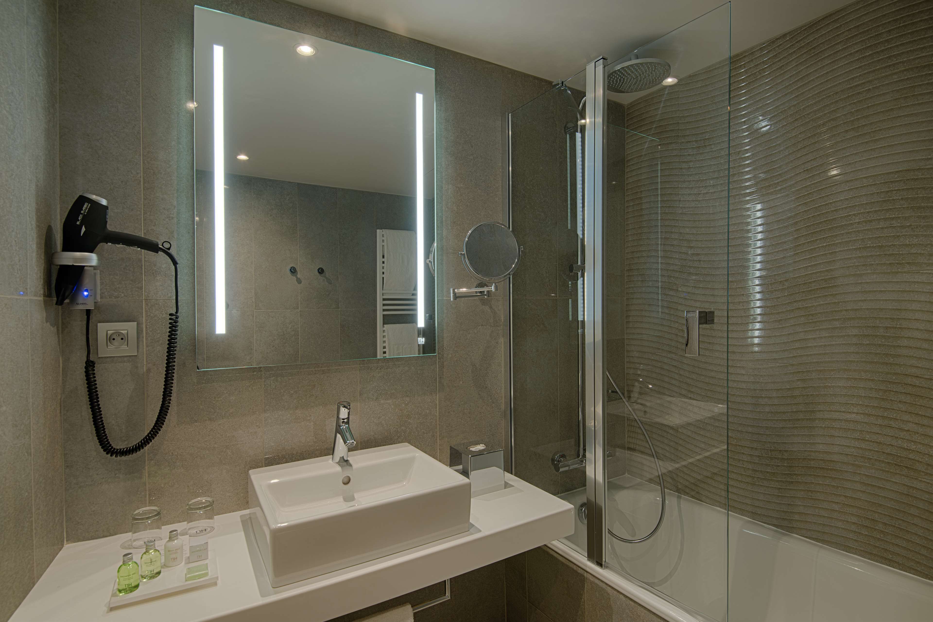 rainfall showerhead, eco-friendly toiletries, hair dryer, towels