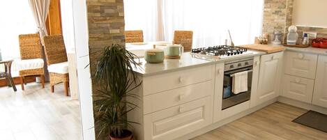 Apartment, 3 Bedrooms, 2 Bathrooms | Private kitchen | Full-size fridge, highchair, cookware/dishes/utensils