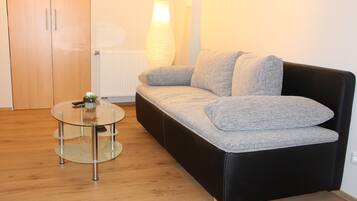 Classic Apartment, 1 Bedroom | Living area | Flat-screen TV