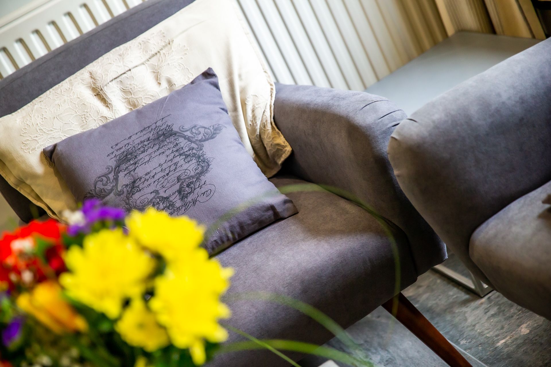 A chair with a cushion featuring a decorative design.