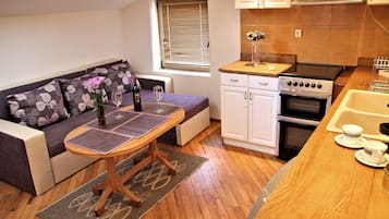 Romantic Apartment, 1 Bedroom, Sea View | Living room | Flat-screen TV