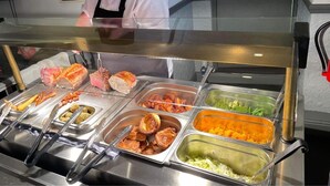 A buffet with various food options including meats, vegetables, and desserts. - The Kings Arms (North Walsham)