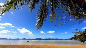 On the beach, sun loungers, beach towels, beach bar