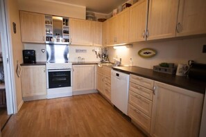 Apartment, 2 Bedrooms | Private kitchen | Fridge, microwave, coffee/tea maker, cookware/dishes/utensils