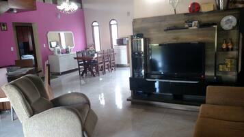 Family Cottage, Multiple Beds, Non Smoking, Mountain View | Living room | Flat-screen TV