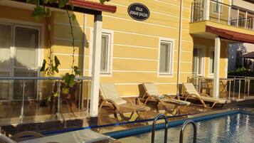 Outdoor pool, pool umbrellas, pool loungers