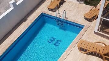 Outdoor pool, pool umbrellas, pool loungers