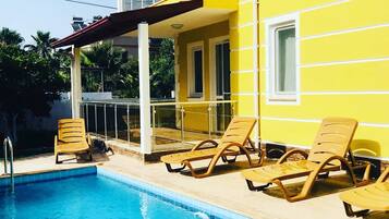 Outdoor pool, pool umbrellas, pool loungers
