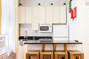 Fridge, microwave, stovetop, coffee/tea maker